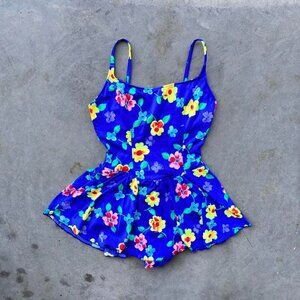 80s neon one piece swimsuit with bright blue and yellow floral pattern